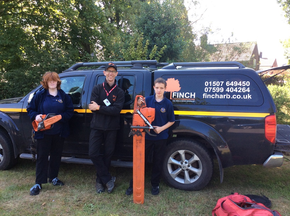 Pupils standing with Finch Arb owner Mike