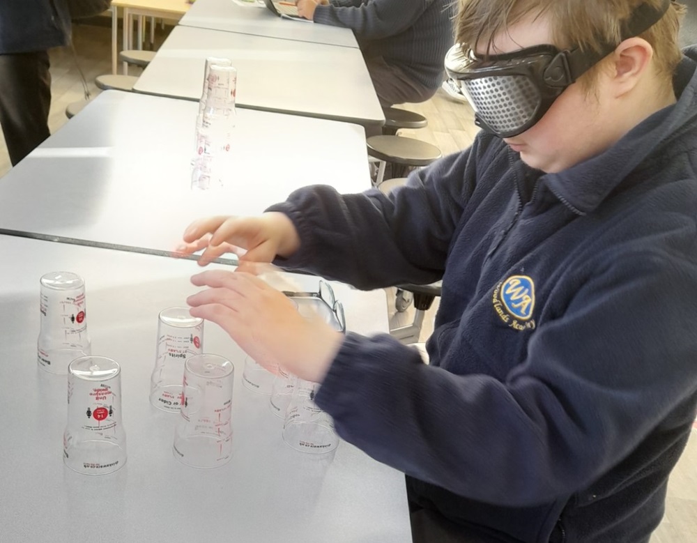 Pupil trying our 'drunk goggles'